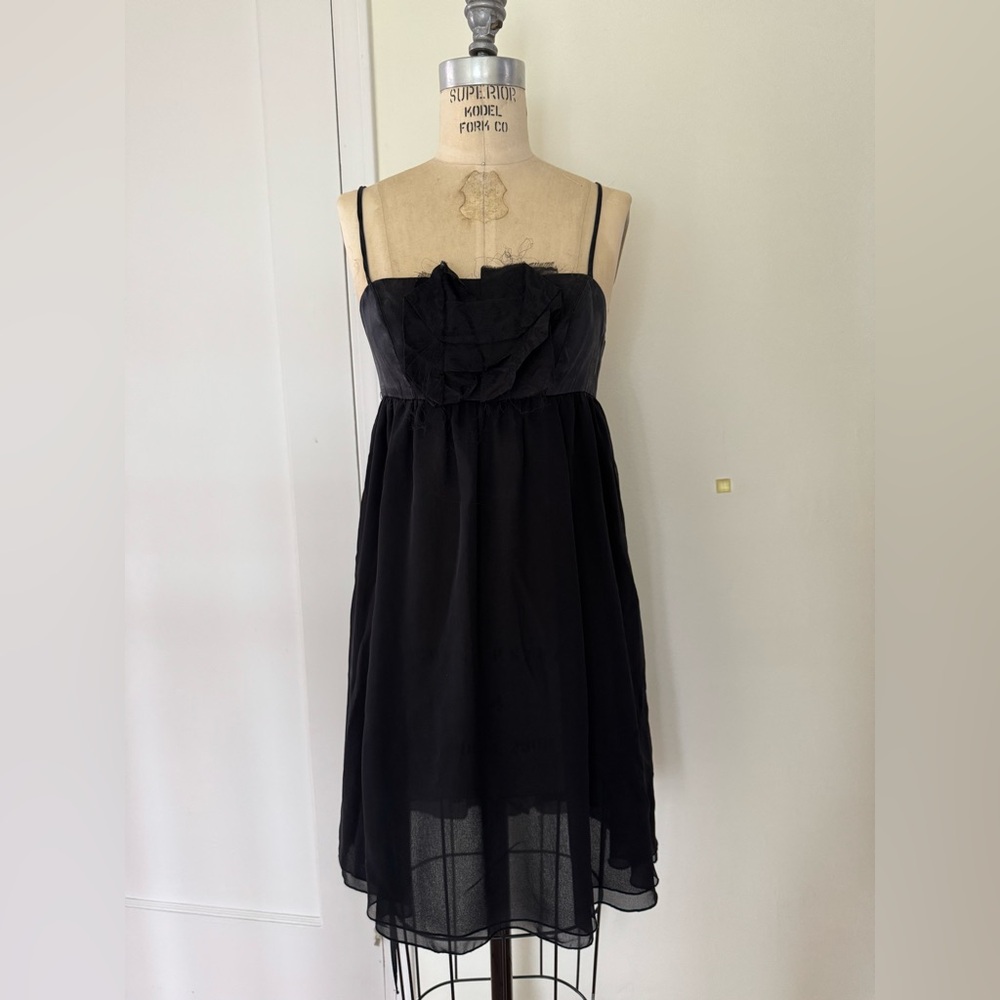 100% silk made in USA Black Dress with adjustable strap and elastic back panel.